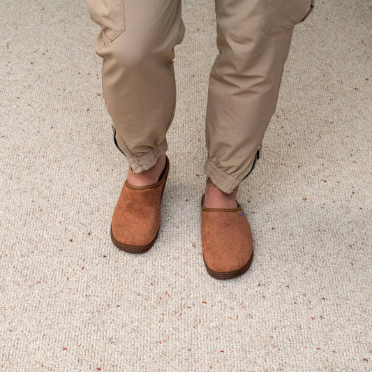 Man wearing DrLuigi® brown cotton medical slippers, standing view