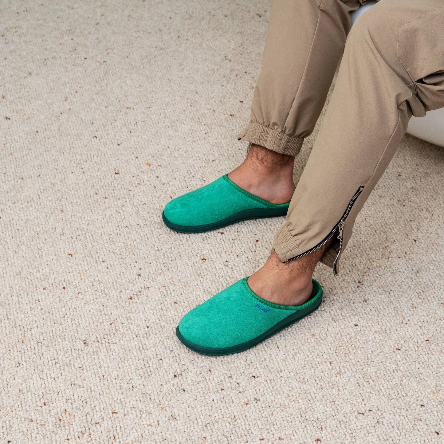 Man wearing DrLuigi® green cotton medical slippers, side view