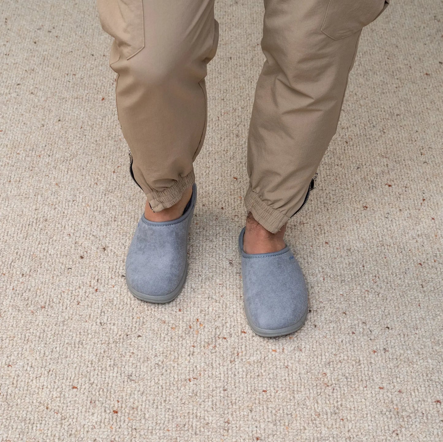 Man wearing DrLuigi® grey cotton medical slippers, standing view