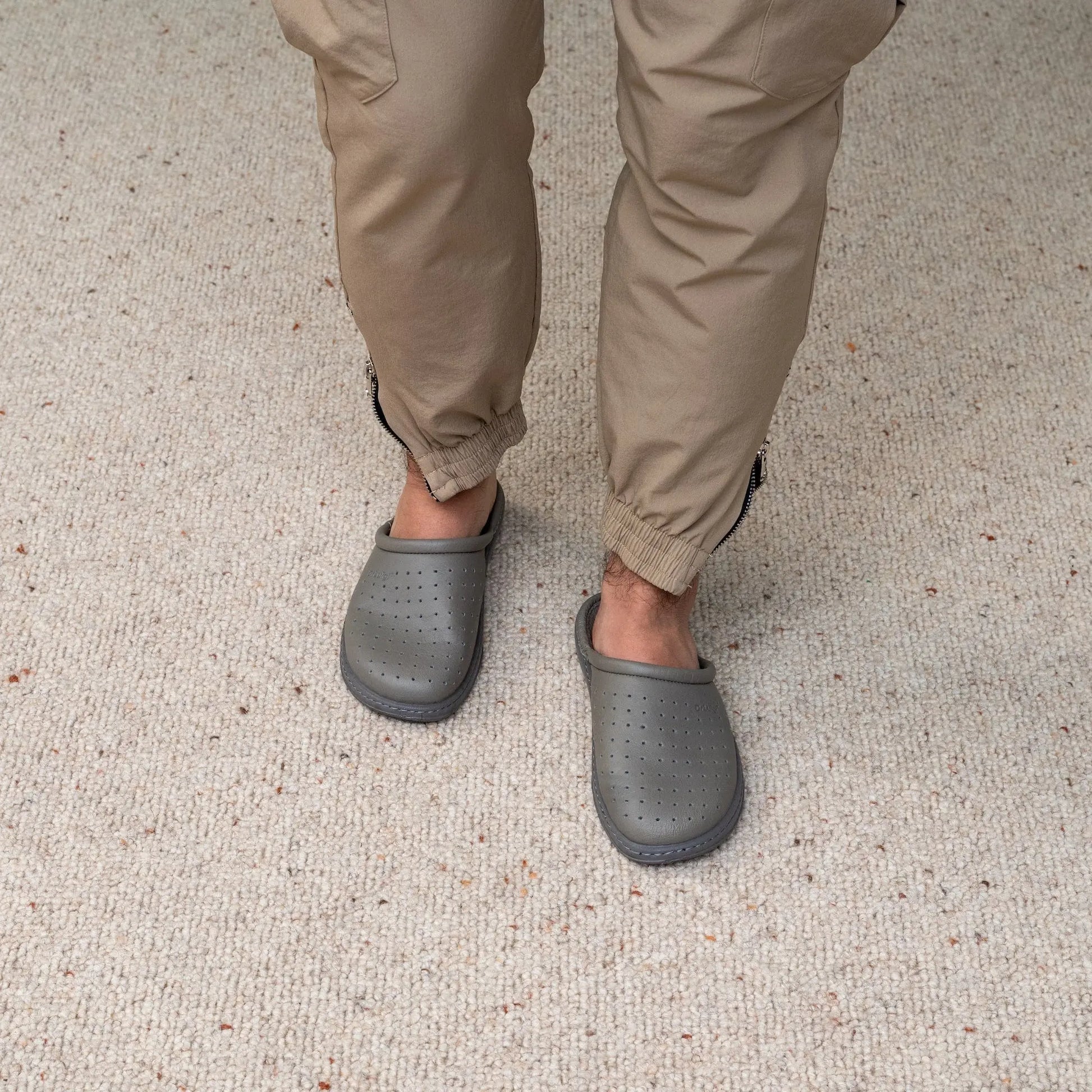 Man wearing DrLuigi® grey leather orthopedic clogs, standing view