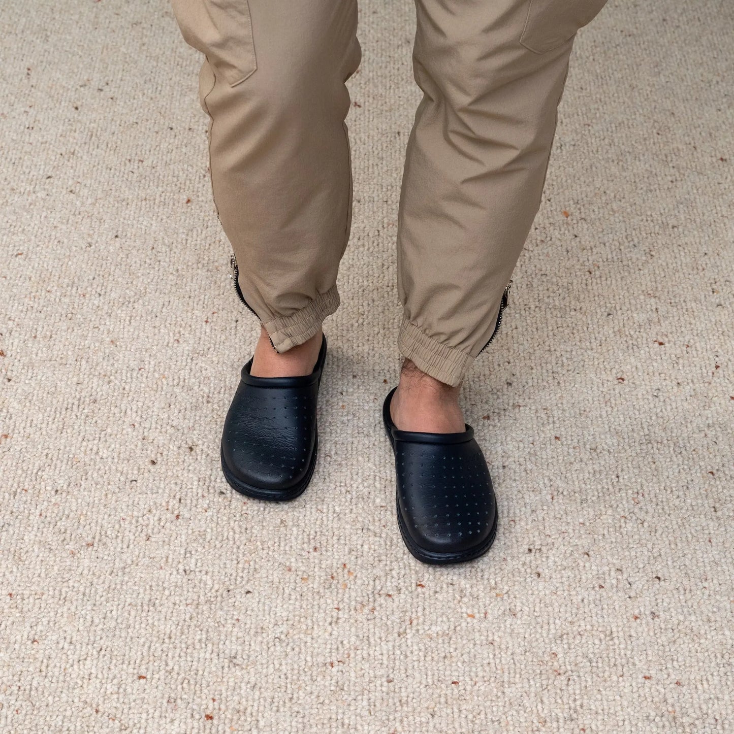 Man wearing DrLuigi® navy blue leather orthopedic clogs, standing view